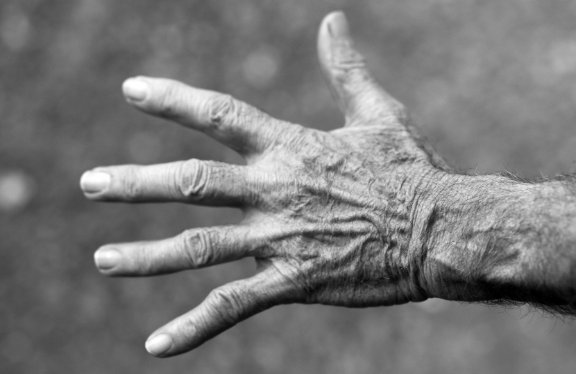 An elderly lady's hand.