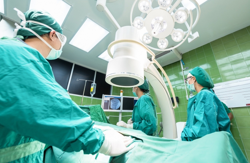 A surgical team in an operating theatre.